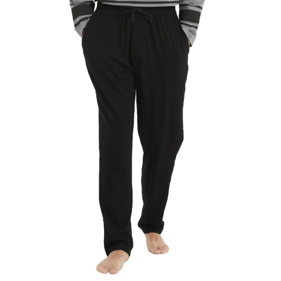 Man wearing a gray and black pajama set on a white background