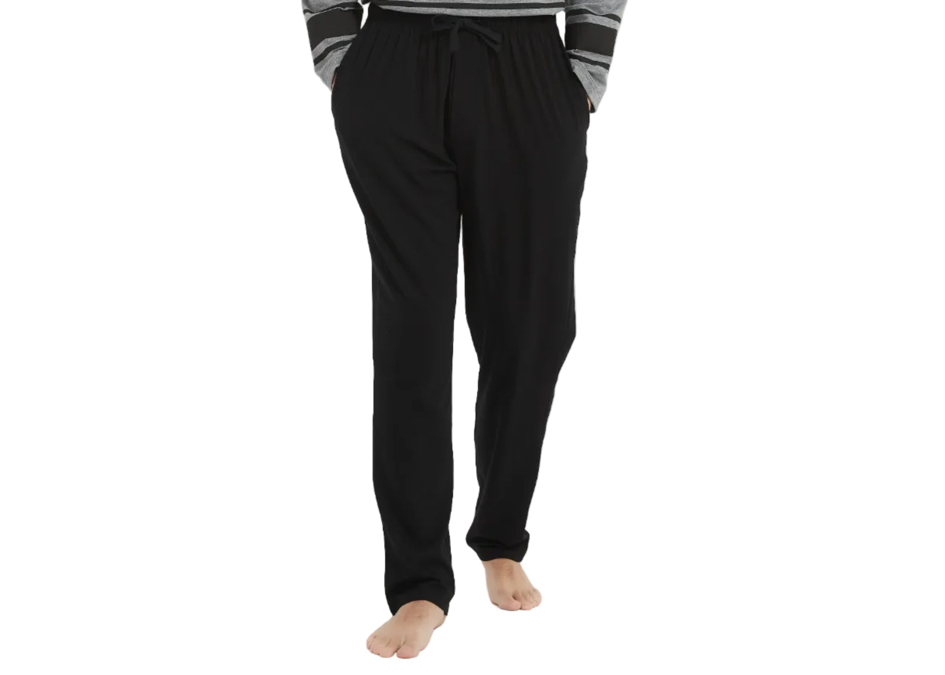 Man wearing a gray and black pajama set on a white background