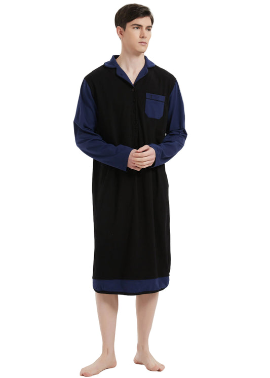 A man modeling a long-sleeve black robe with navy blue collar, cuffs, and pocket, standing against a plain white studio background.