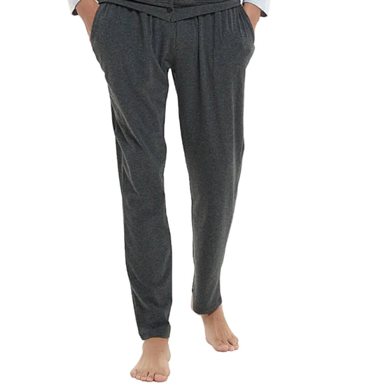 Man wearing a gray pajama set on a white background