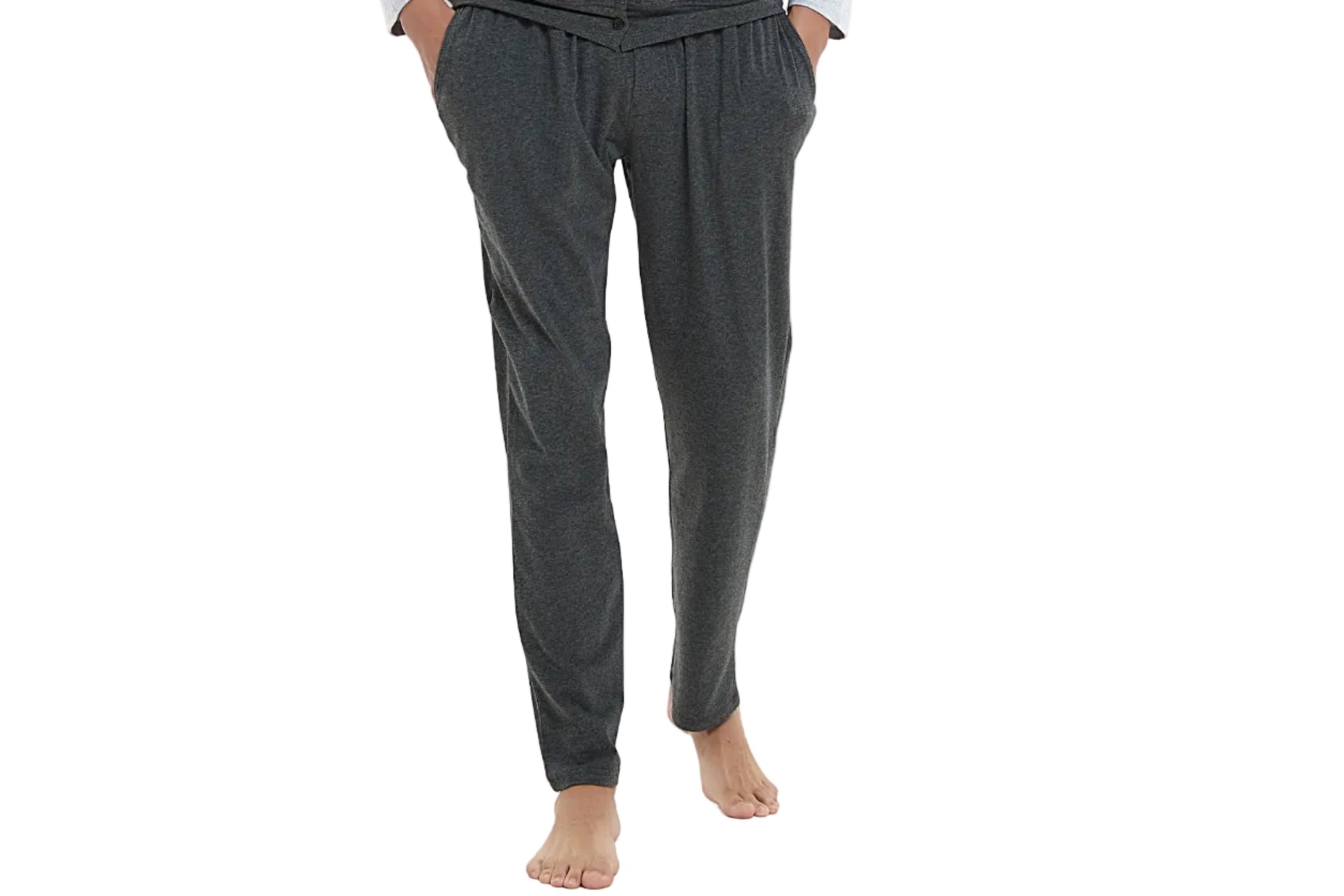 Man wearing a gray pajama set on a white background