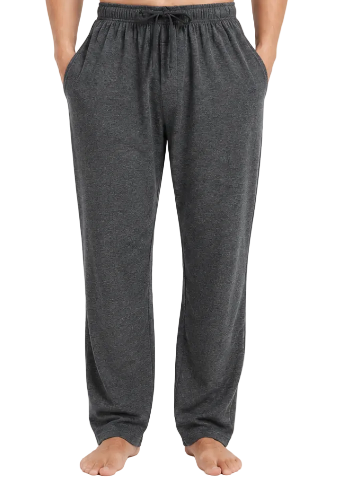 A person wearing dark gray heather lounge pants with an elastic drawstring waistband and side pockets, standing barefoot against a light gray studio background.